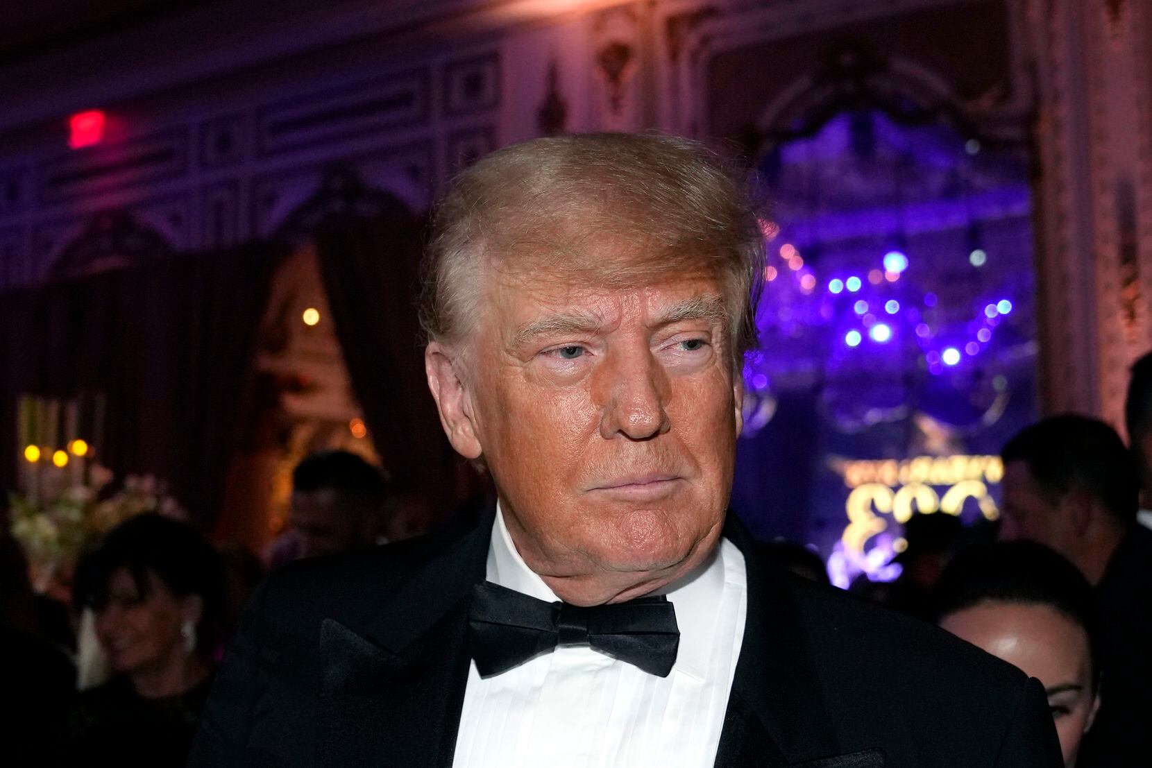 FILE - Former President Donald Trump arrives for a New Year's Eve party at Mar-a-Lago, in...