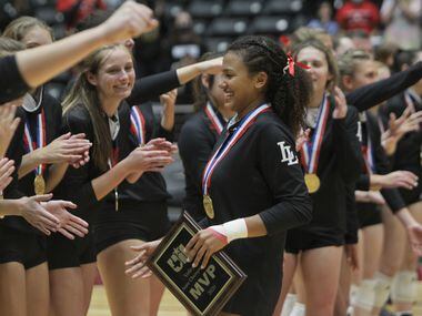 Lovejoy's Cecily Bramschreiber (5) was welcomed with open arms by her teammates after she...