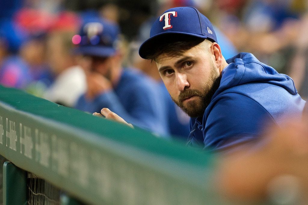Injured Texas Rangers outfielder Joey Gallo watches from the dugout during the sixth inning...