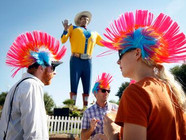Sept. 30, 2010: Employees of The Dow Group, clad in mowhawk wigs, took off the day to enjoy...