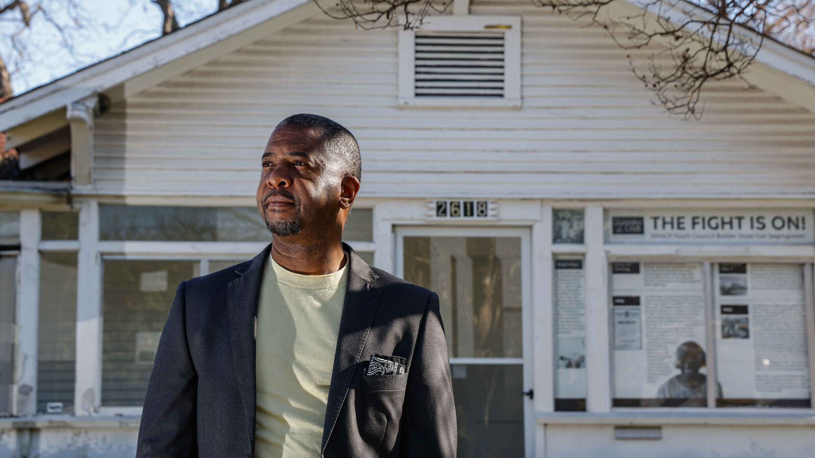 John Spriggins, shown in front of the historic Juanita Craft house in South Dallas, is manager of the South Dallas Cultural Center, which is overseeing work to restore the home where Craft, a noted Black civil-rights leader, once lived.