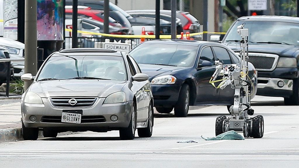 A law enforcement robot ripped the window out of the vehicle the shooter arrived in after shots were fired Monday morning, June 17, 2019, at the Earle Cabell federal courthouse in downtown Dallas. Law enforcement returned fire and killed the shooter, Brian Clyde. Dallas police detonated a suspicious device about 10:40 a.m. that was found in the 2003 Nissan Altima Clyde had driven to the courthouse.