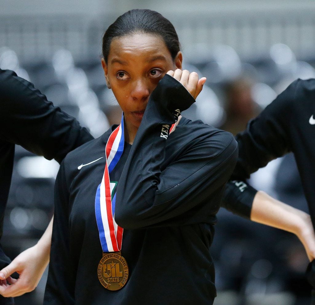Kennedale Blair Ingram-Everett (13) wipes her tears after losing a Class 4A volleyball state...