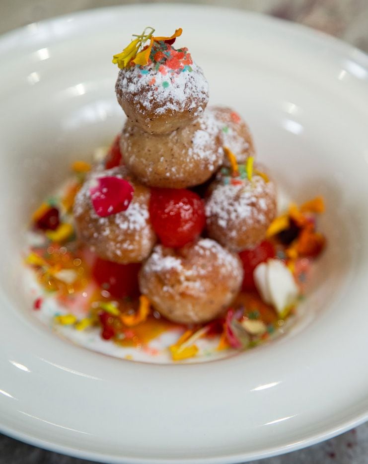 Sumac doughnut holes with candied cherries, honey and pop rocks