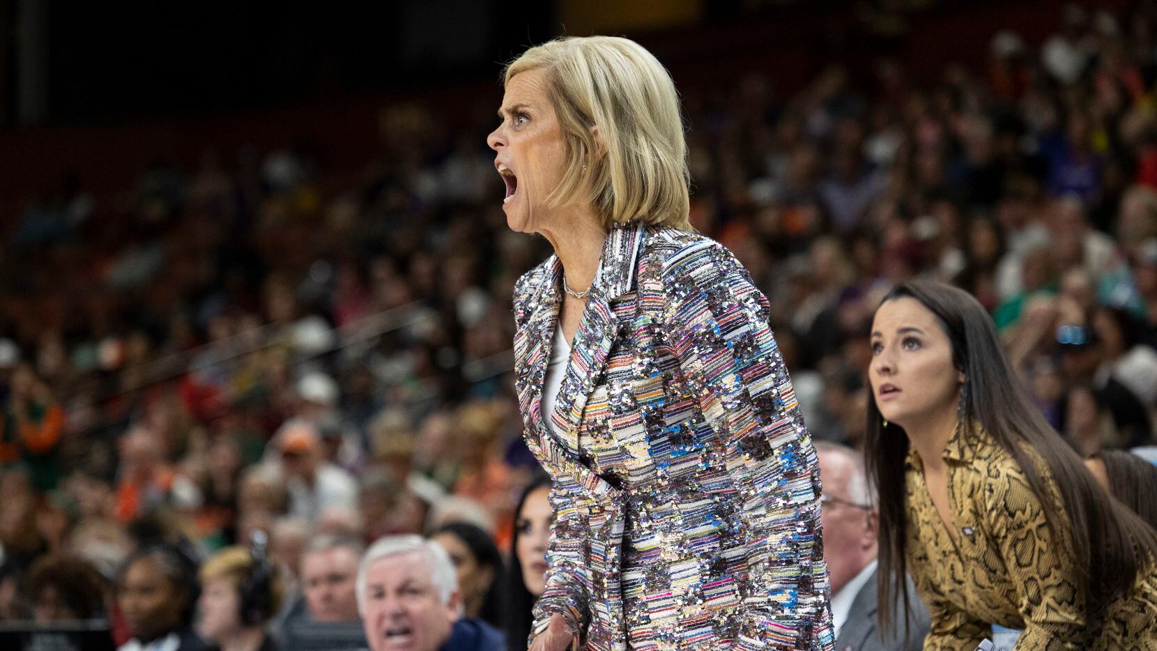 LSU head coach Kim Mulkey yells during the first half of an Elite 8 college basketball game...