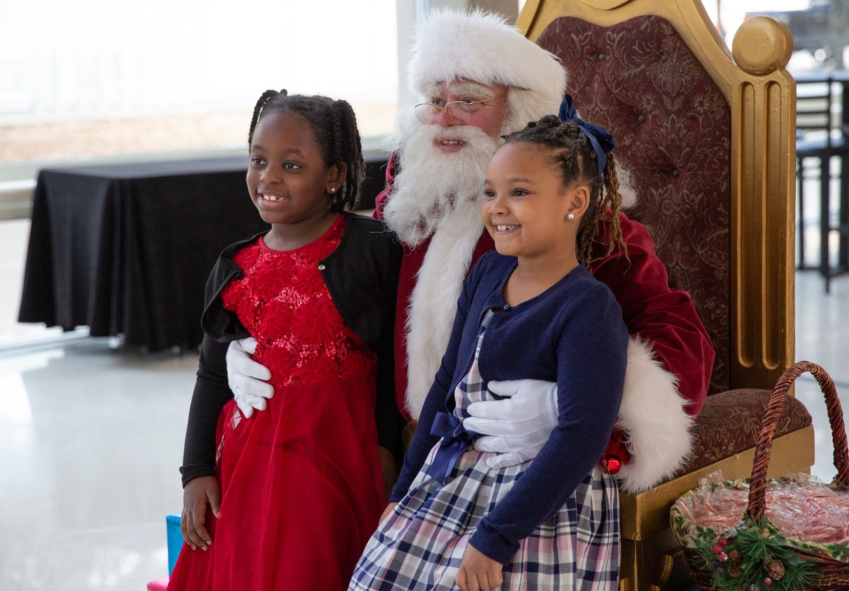 Guests of the Dallas Symphony's annual Christmas Pops tradition pose with Santa Claus.