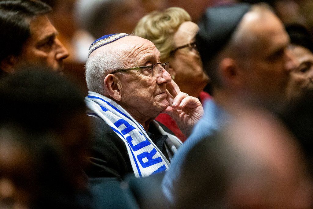 Holocaust survivor Max Glauben listens as Bradley Laye, president and CEO at the Jewish...