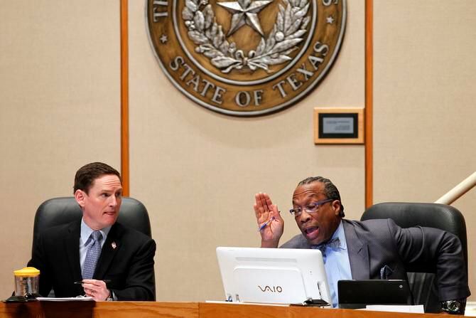 
County Judge Clay Jenkins (left) and Commissioner John Wiley Price conduct business in the...