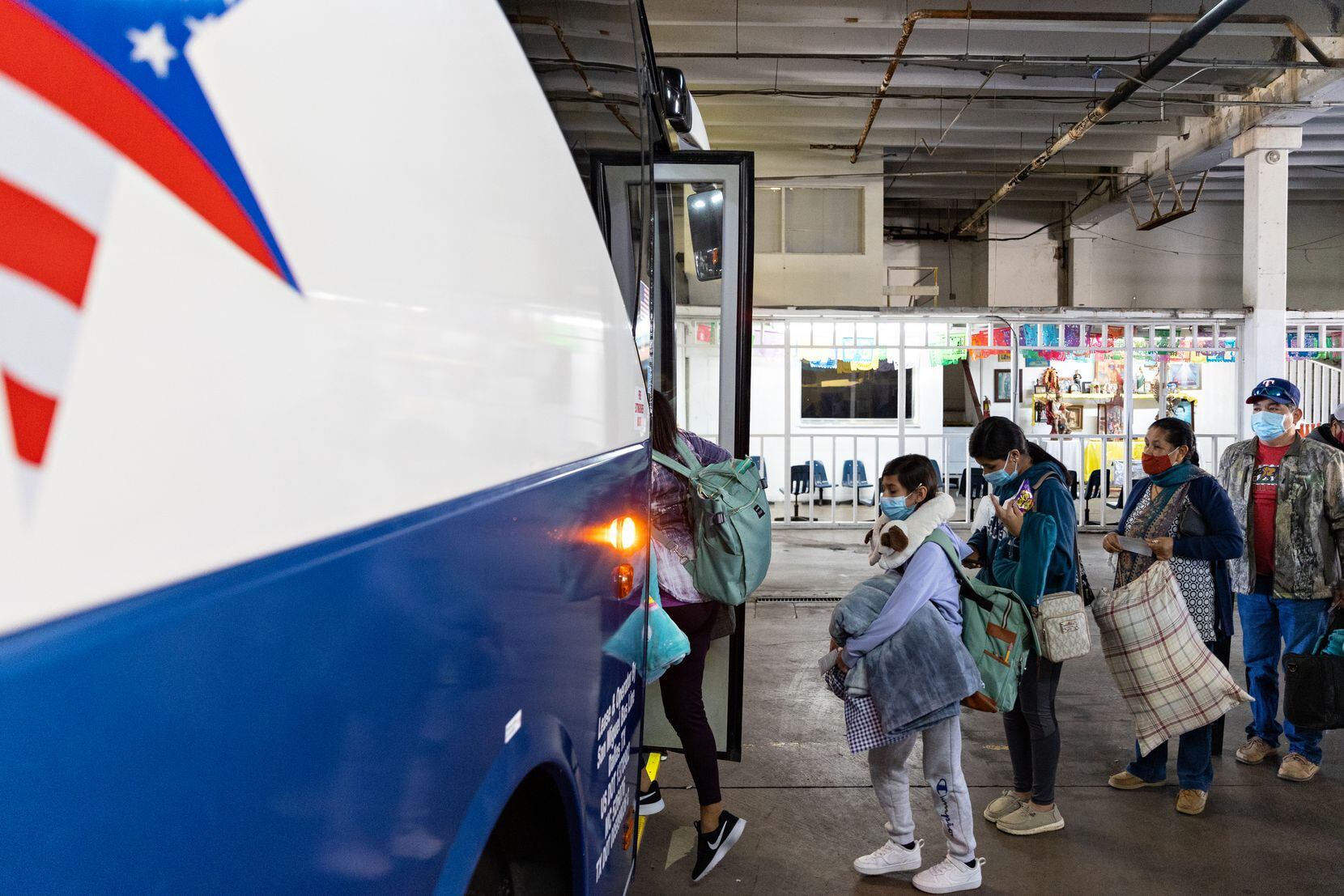 Passengers board the bus at the Transportes San Miguel bus terminal in Oak Cliff on March...