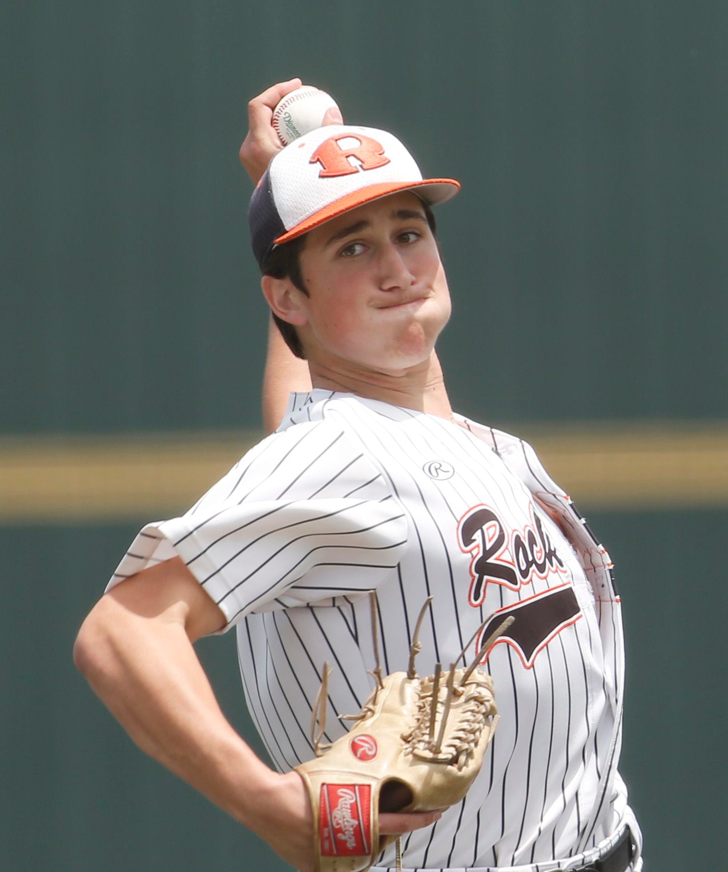 Rockwall pitcher Cade Crossland (8) delivers a pitch in the top of the first inning of play...