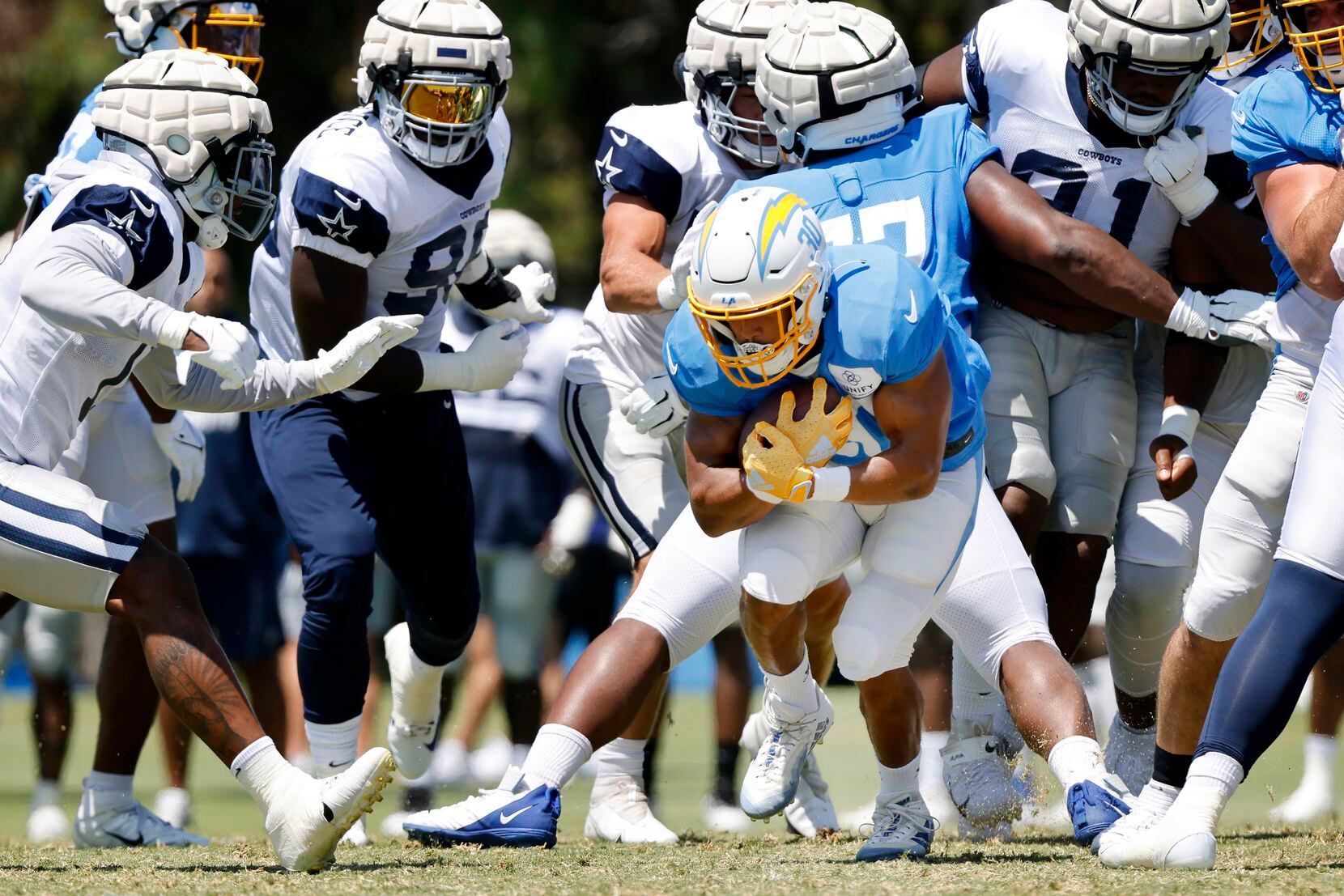 Los Angeles Chargers running back Austin Ekeler (30) finds a hole to run through in the...