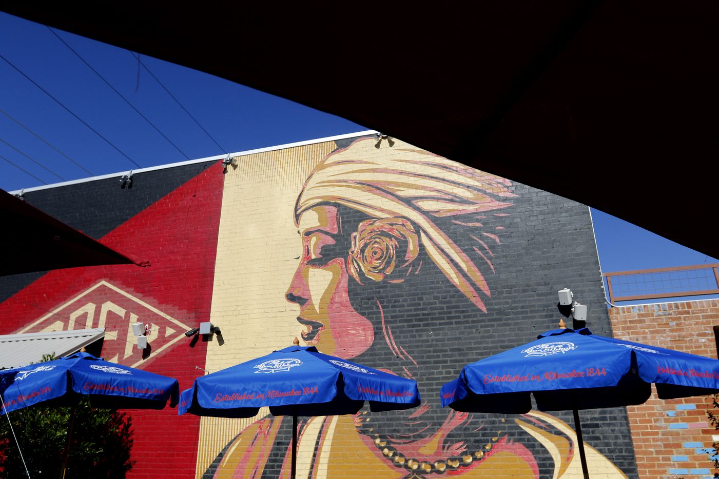 A mural, painted by graffiti artist Shepard Fairey, on the east side of the Off-Site Kitchen...