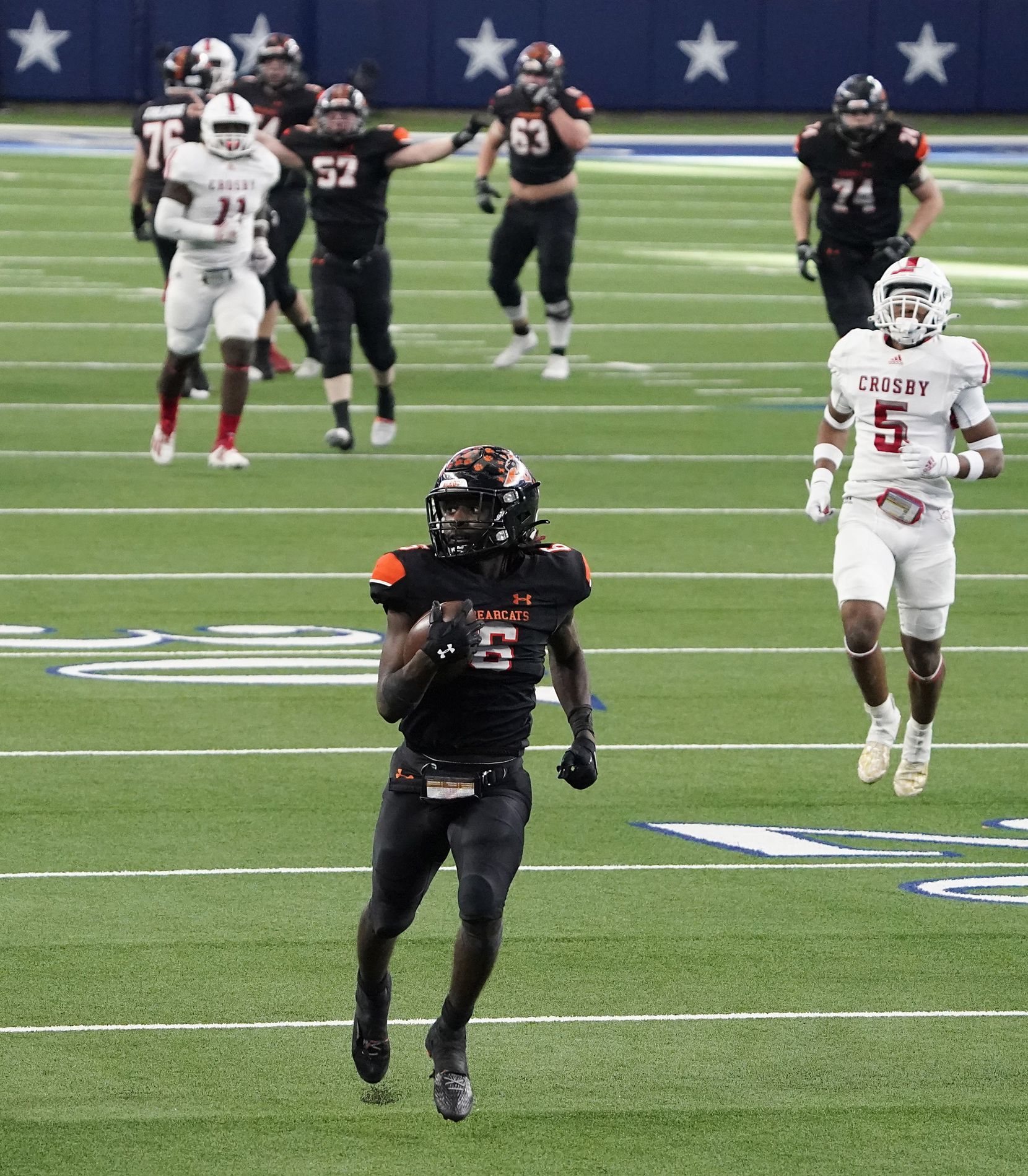 Aledo running back DeMarco Roberts (6) races through the defense on a 54-yard touchdown run during the second half of a 56-21 victory over Crosby to win the Class 5A Division II state football championship game at AT&T Stadium on Friday, Jan. 15, 2021, in Arlington. The victory gave the Bearcats the 10th state championship in school history. (Smiley N. Pool/The Dallas Morning News)