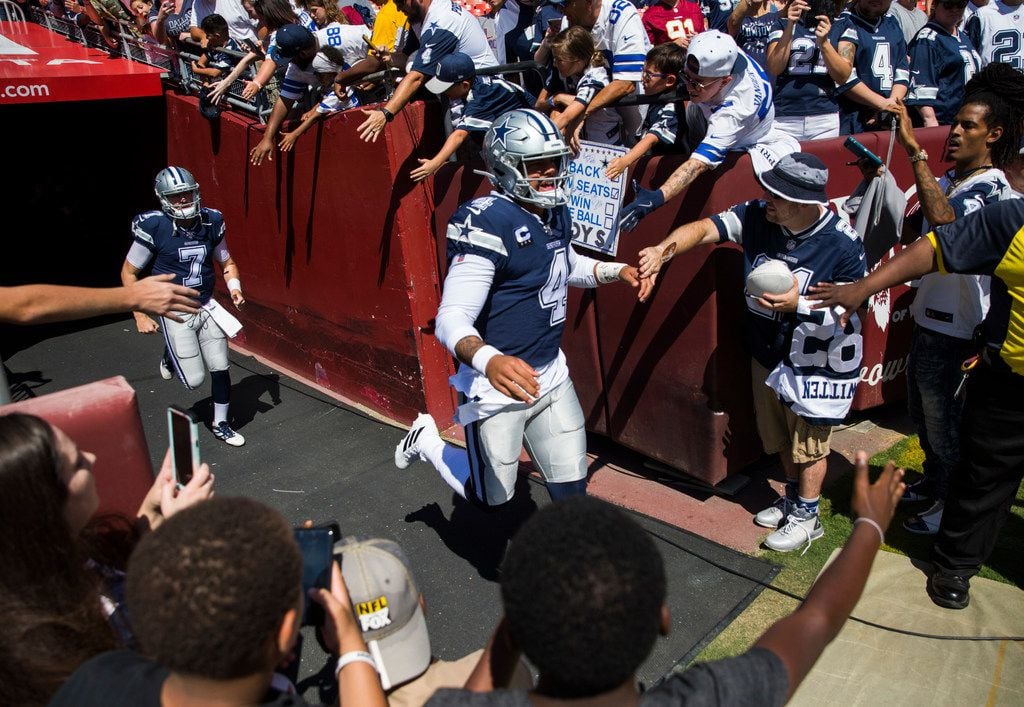 Dallas Cowboys quarterback Dak Prescott (4) enters the field to warm up before an NFL game...