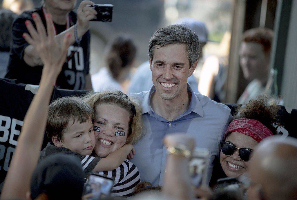 Democratic presidential candidate Beto O'Rourke poses for a photo with supporters following...