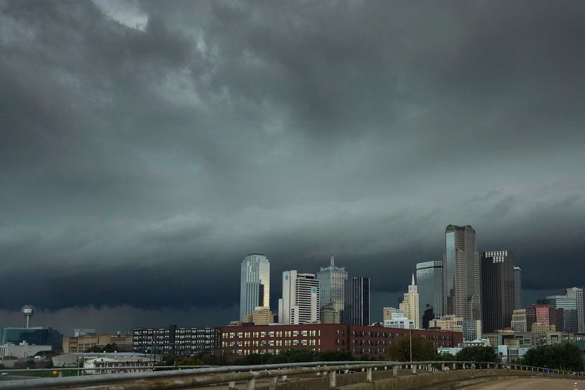 Storm clouds rolled over the downtown skyline as severe storms moved through North Texas on...