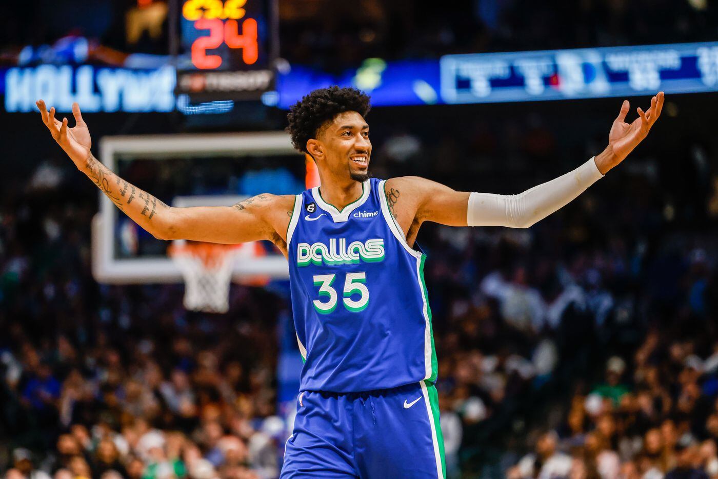 Dallas Mavericks forward Christian Wood (35) celebrates a dunks during the third quarter at...