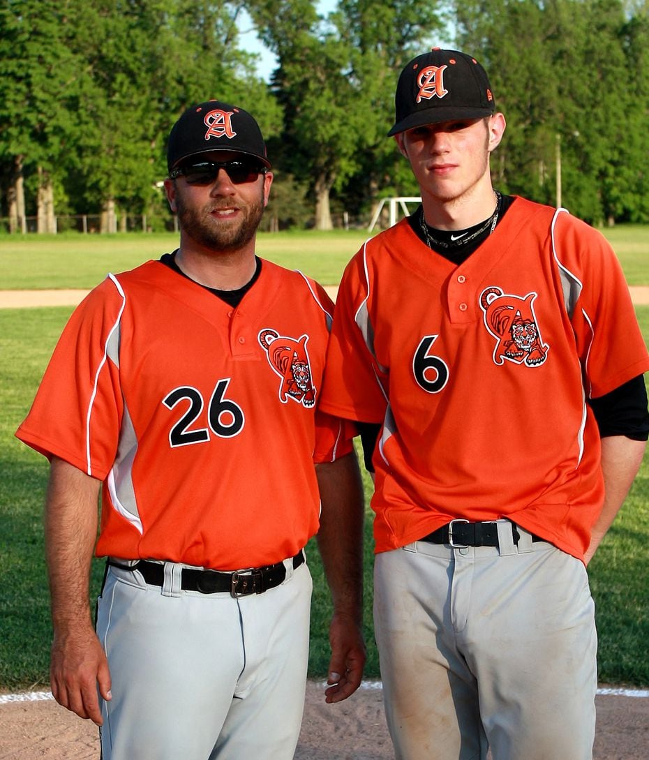 Texas Rangers catcher Jonah Heim, right, is pictured in his Amherst High School uniform with...