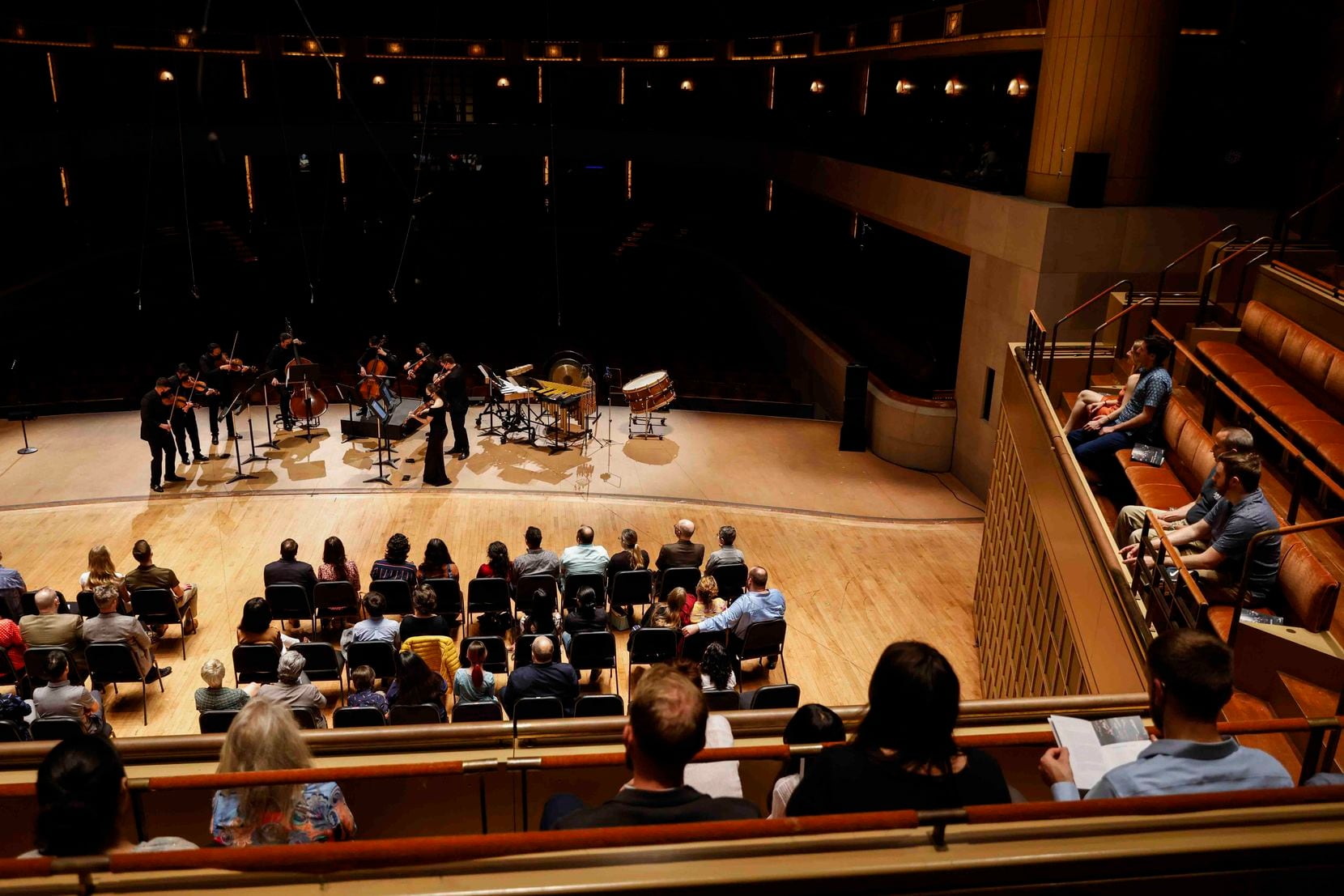 The audience listens to the Baumer String Quartet and Dallas Symphony Orchestra musicians...
