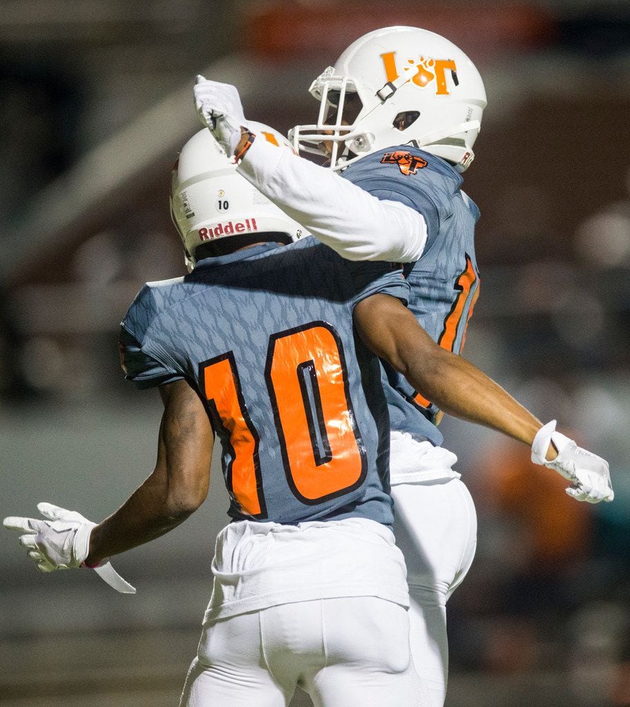 Lancaster wide receiver Majik Rector (10) celebrates with wide receiver Latrell Caples (15)...