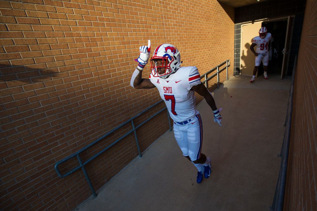 FILE - Southern Methodist Mustangs cornerback Robert Hayes Jr. (7) points upward as he makes his way to the field prior to a game between University of North Texas and Southern Methodist University on Saturday, September 1, 2018 at Apogee Stadium in Denton, Texas. (Ryan Michalesko/The Dallas Morning News)