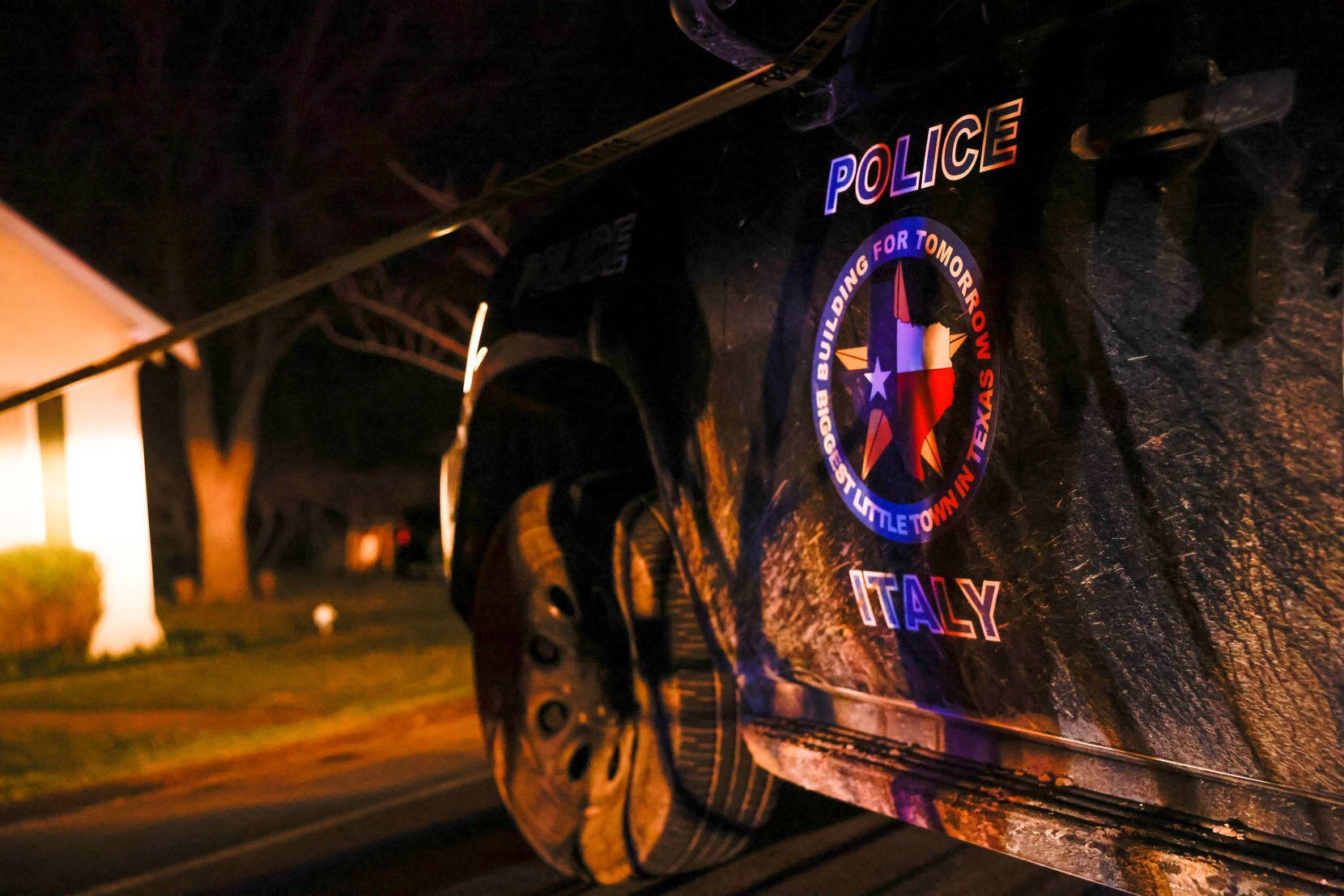 An Italy Police Department car blocks off a portion of South Harris Street, near the home...