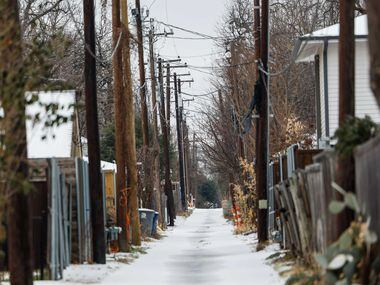 A service alley covered with sleet near Skillman St on Tuesday, Jan. 31, 2023. Weather...