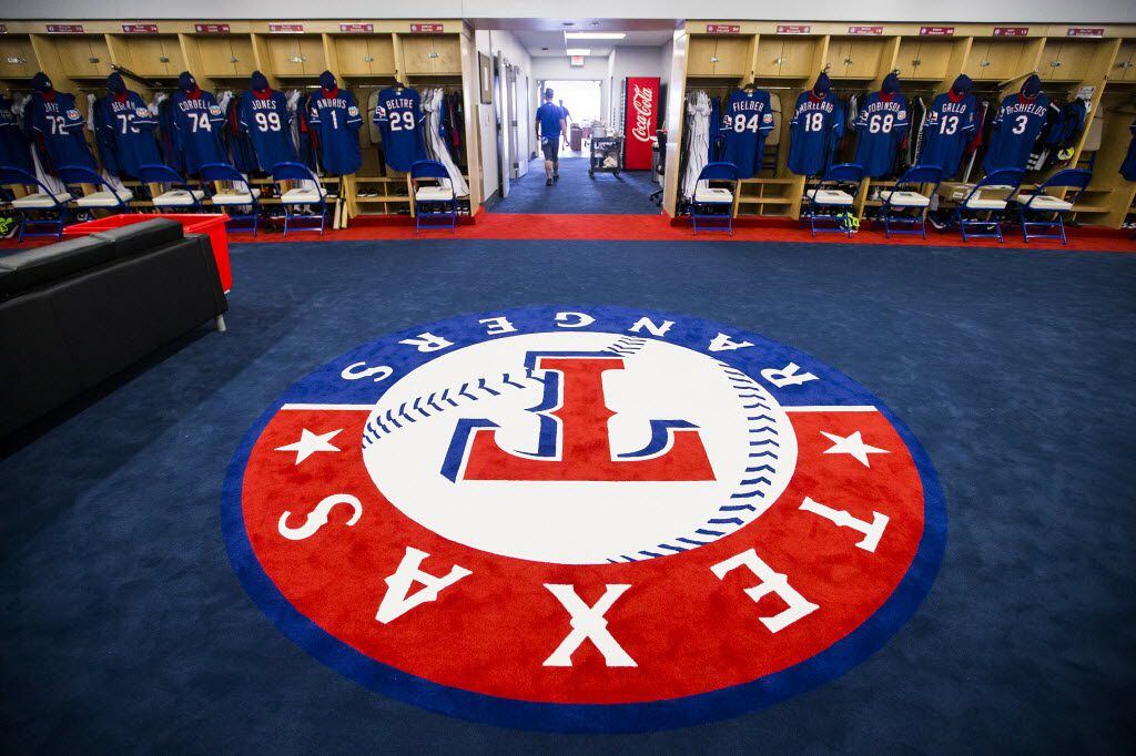 FILE - The team logo fills the center of the clubhouse in the Rangers' spring training...