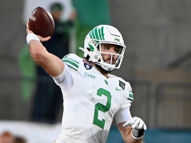 North Texas quarterback Austin Aune throws a pass during the second half of the team's Frisco Football Classic NCAA college football game against Miami (Ohio) in Frisco, Texas, Thursday, Dec. 23, 2021.