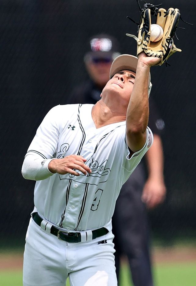 Prosper third baseman Austin Rogers makes the catch on a popup against Coppell during game 3...