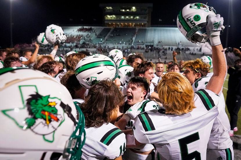 Southlake Carroll players celebrate after a 36-35 victory over Rockwall-Heath in a high...
