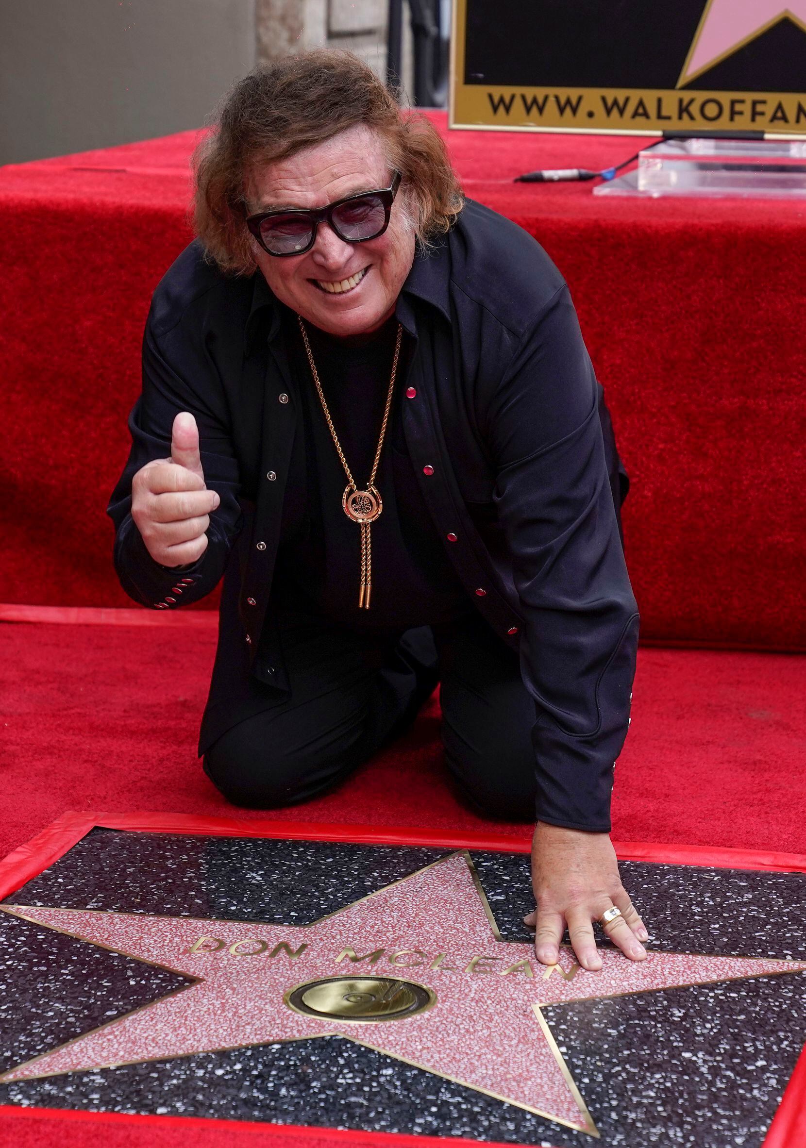 FILE - Don McLean poses over his new star on the Hollywood Walk of Fame Aug. 16, 2021, in...