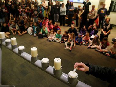 A menorah is lighted at the Aaron Family Jewish Community Center.