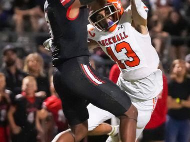 Rockwall defensive back Cadien Robinson (13) breaks up a pass intended for Rockwall-Heath...