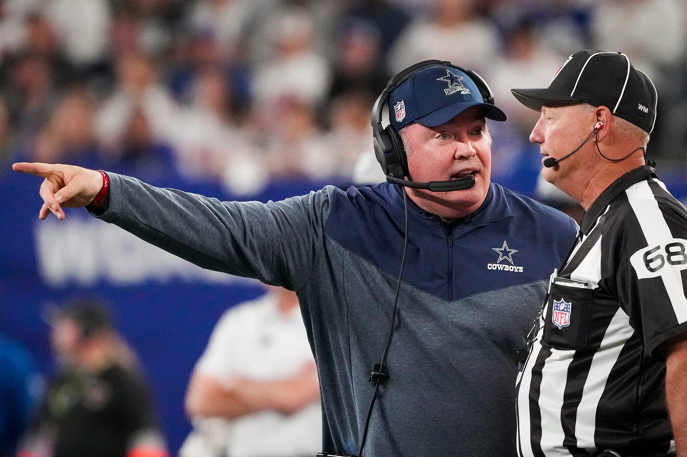 Dallas Cowboys head coach Mike McCarthy argues for a call with down judge Tom Stephan during...