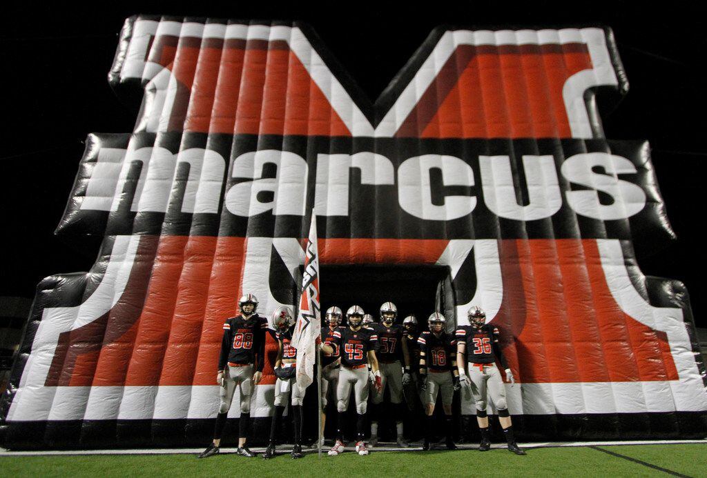Members of the Flower Mound Marcus Marauders await the opportunity to rush onto the field...
