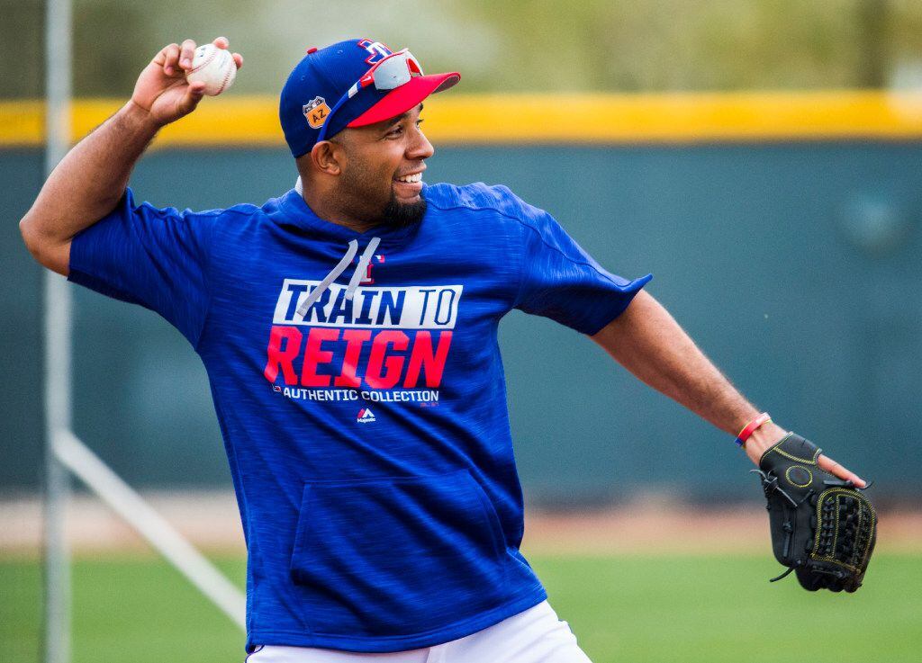 Texas Rangers shortstop Elvis Andrus (1) throws to first base during a spring training...