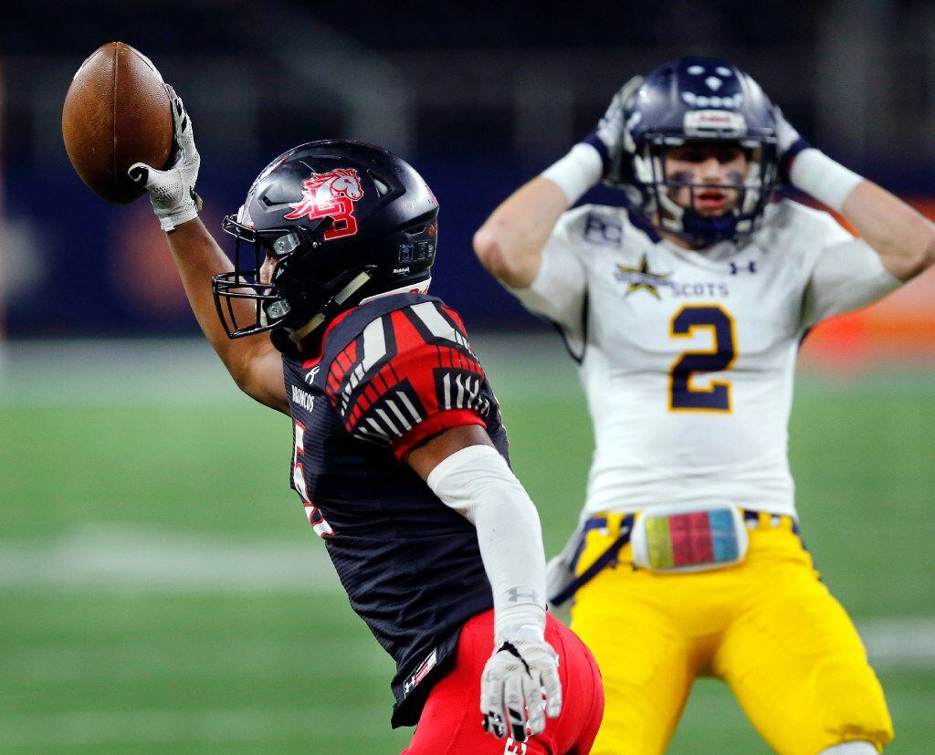 Mansfield Legacy defensive back Jalen Catalon (5) comes up with an interception as Highland Park wide receiver Parker Alexander (2) reacts in the first quarter of their Class 5A Division I Region II final at AT&T Stadium in Arlington, Texas, Friday, December 2, 2016. (Tom Fox/The Dallas Morning News)