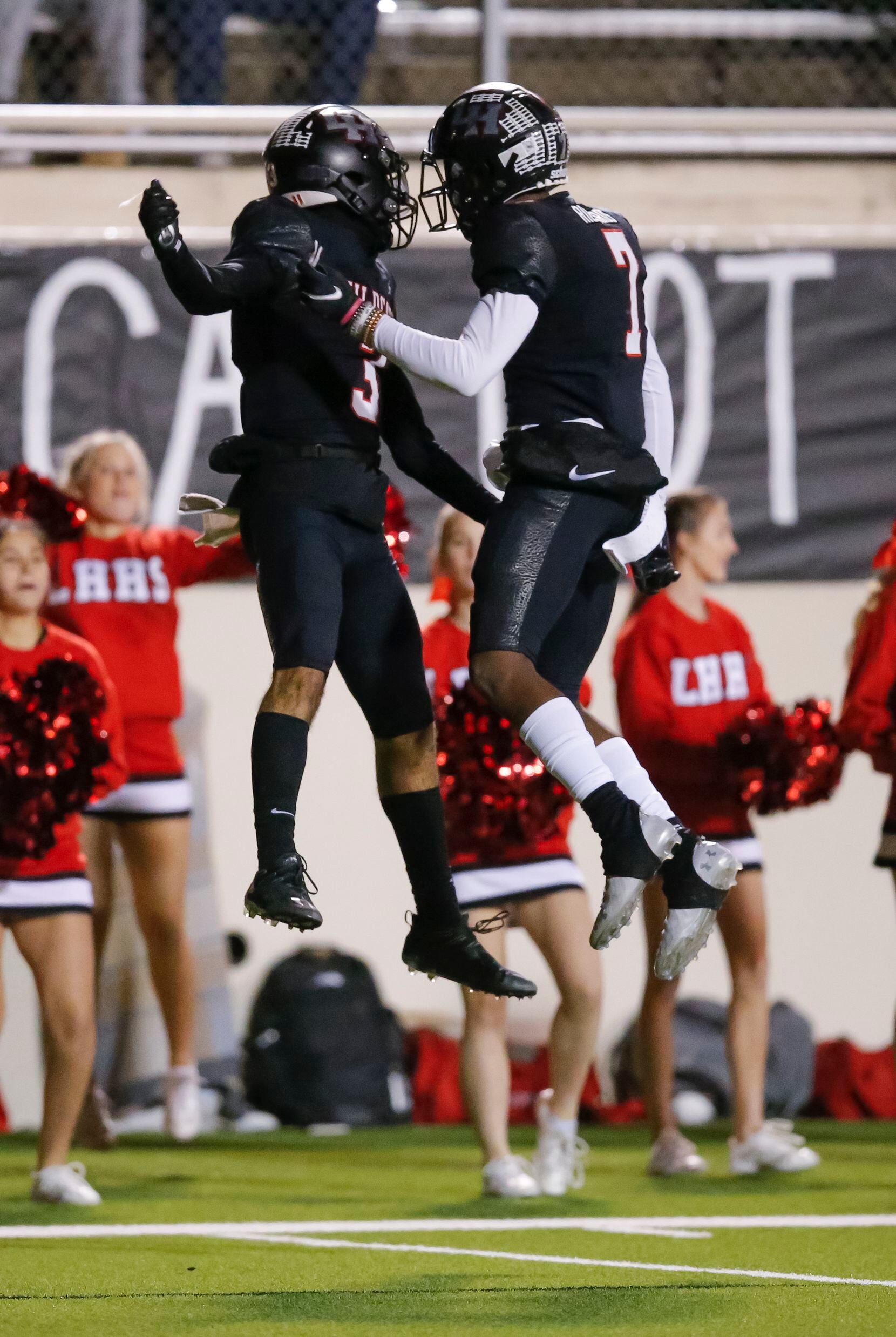 Lake Highlands sophomore wide receiver Deonte Dean (3) is congratulated by senior wide...