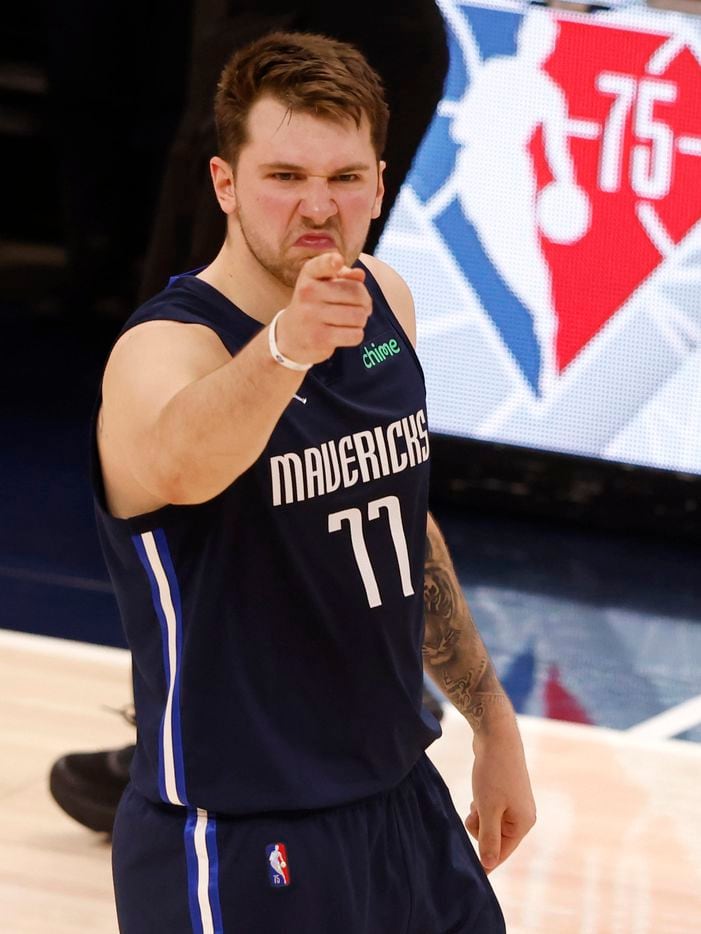 Dallas Mavericks guard Luka Doncic (77) celebrates after making a three pointer in front of...