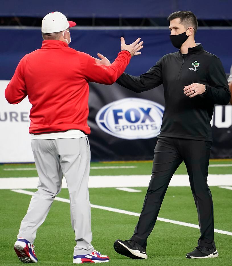 Southlake Carroll head coach Riley Dodge (right) shakes hands with his father, Austin Westlake head coach Todd Dodge, before the two faced in the Class 6A Division I state football championship game at AT&T Stadium on Saturday, Jan. 16, 2021, in Arlington, Texas. (Smiley N. Pool/The Dallas Morning News)