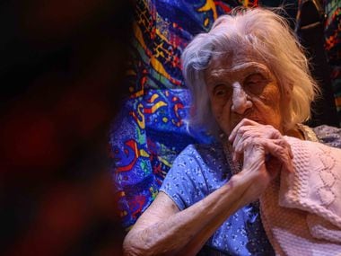 Maria Barajas, who is 100 years old and has dementia, prepares to spend the night on the bus...