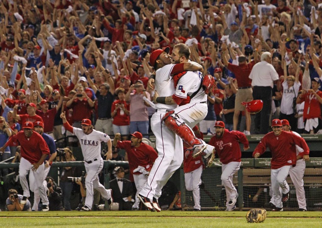 Texas RP Neftali Feliz and C Mike Napoli celebrate the final out as the Rangers win the AL...