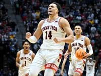 Texas Tech forward Marcus Santos-Silva (14) reacts at the end of a second-round NCAA college...