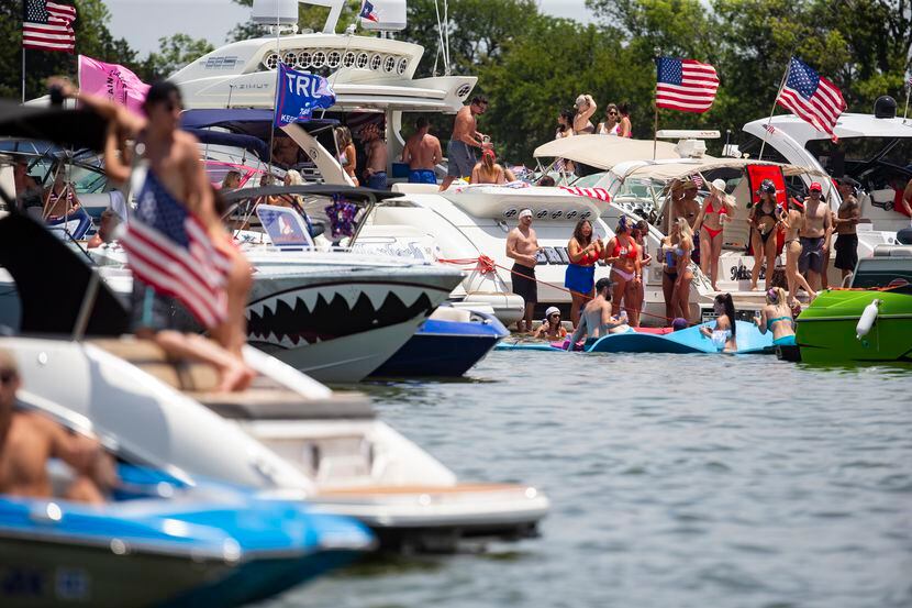 Revelers, many without masks, were out in force Saturday to celebrate Independence Day at...