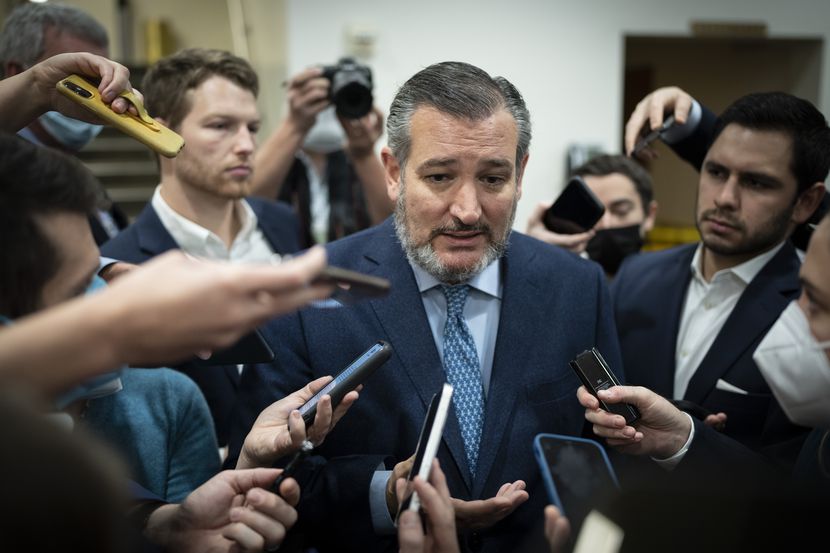 Sen. Ted Cruz talks with reporters on his way to a vote at the Senate on Dec. 2, 2021, a day...