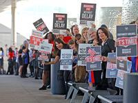 Flight attendants and supporters of their union for Southwest Airlines protested outside of...