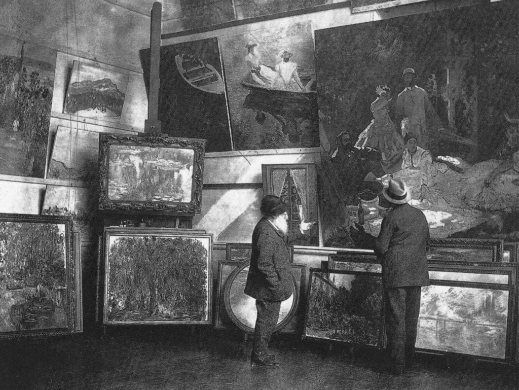 Claude Monet (left) in his second studio in Giverny with the Duc de Trévise, c. 1920. Musée...