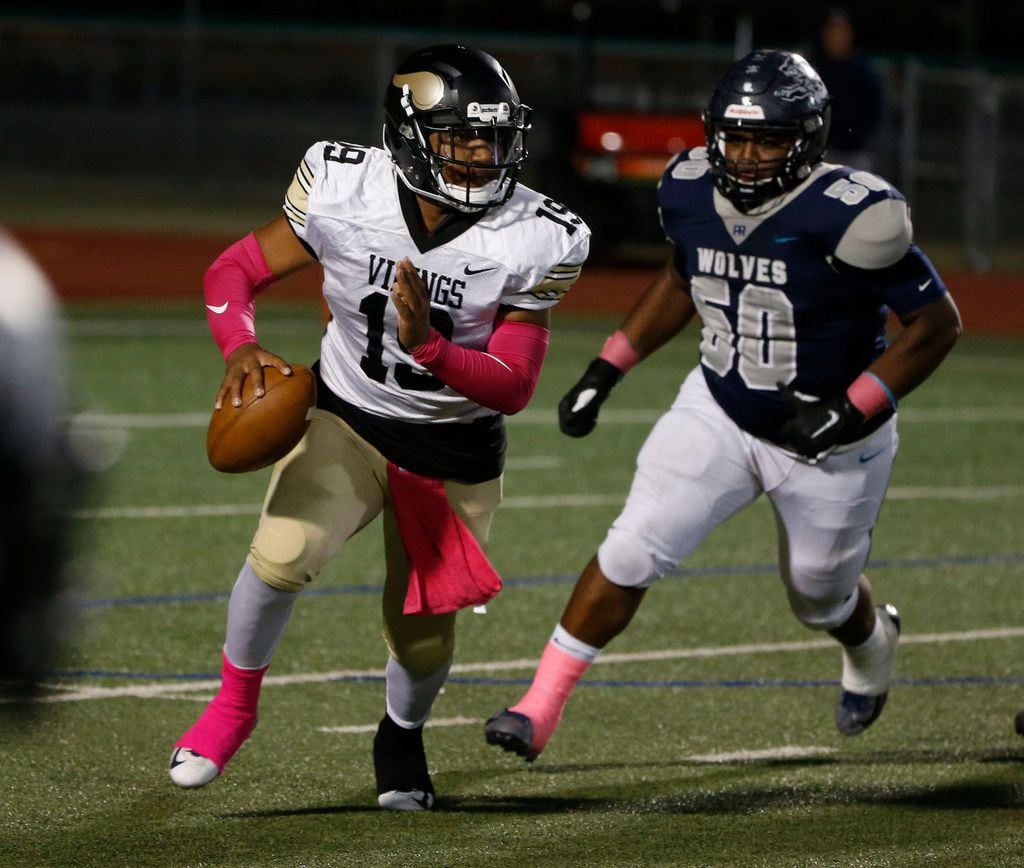 Pinkston's Kendrick Cardell it chased by Ranchview's Kuwan Govan (50) during the first half...
