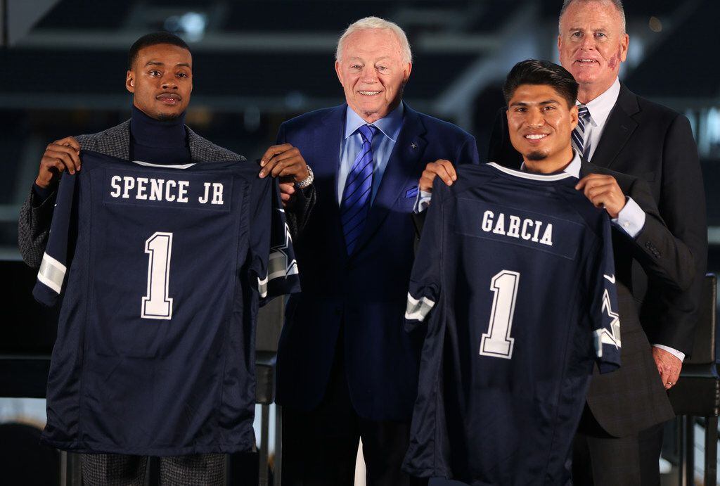 Boxers Errol Spence Jr. (left) and Mikey Garcia pose for photographs with Dallas Cowboys owner Jerry Jones and during a press conference for the Premier Boxing Champions fight between Unbeaten IBF Welterweight World Champion Errol Spence Jr. and undefeated four-division world champion Mikey Garcia at AT&T Stadium on Tuesday, Feb. 19, 2019 in Arlington, Texas. The match will take place at AT&T Stadium on March 16, 2019.  (Rose Baca/Staff Photographer)